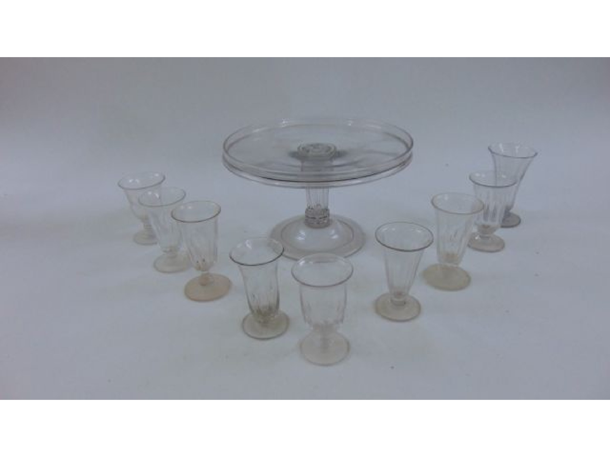 Appraisal: A th century glass table centre on a white and