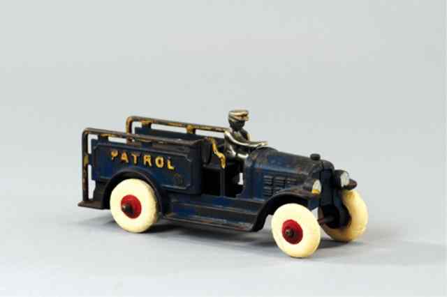 Appraisal: KENTON PATROL TRUCK WITH REMOVABLE DRIVER Cast iron painted in