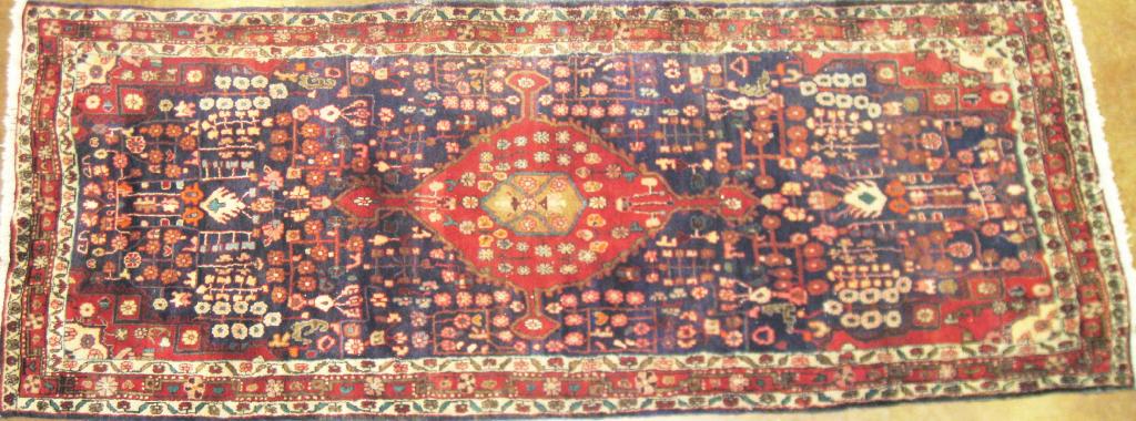 Appraisal: A Hamadan multi-bordered Rug with central red medallion on blue