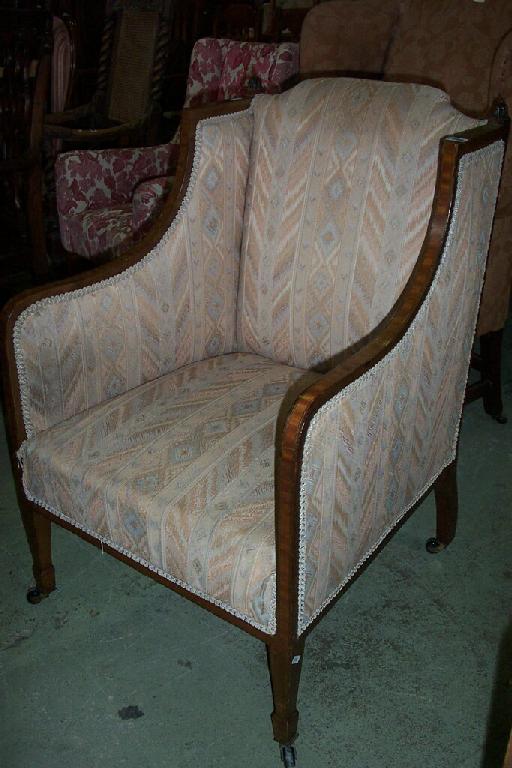 Appraisal: An inlaid Edwardian mahogany tub chair with satin wood banding