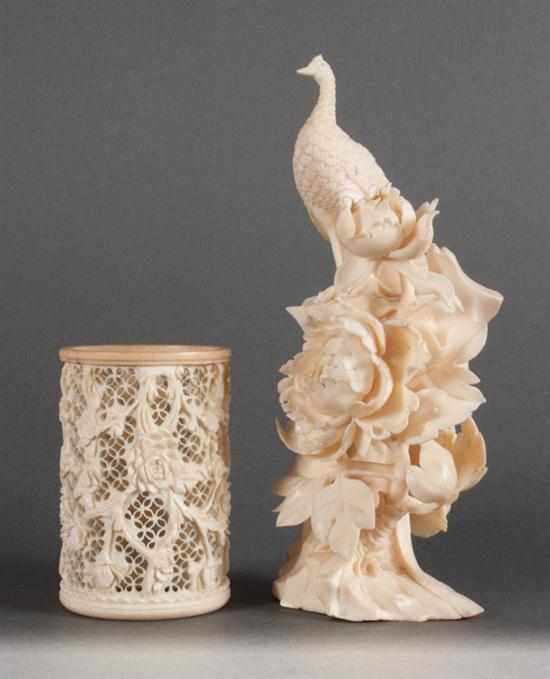 Appraisal: Chinese carved ivory peacock and floral figure and a carved