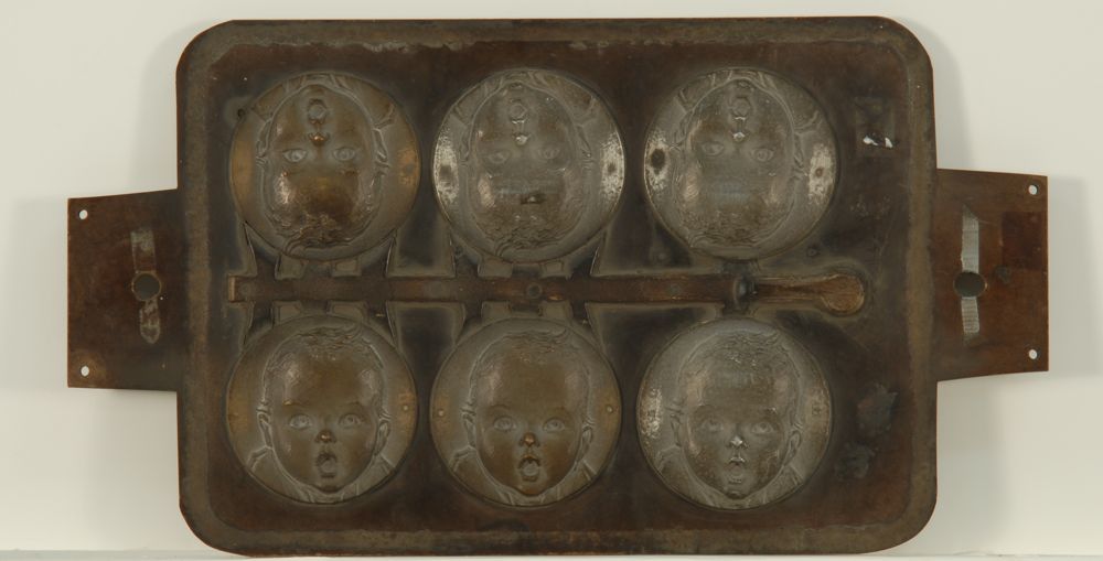 Appraisal: CAST METAL MOLD FOR SIX GERBER BABY FACES x