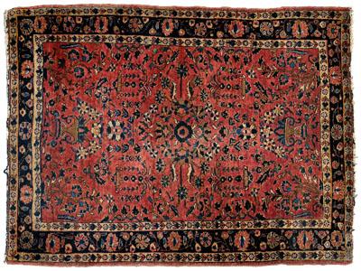 Appraisal: Sarouk rug vase and floral designs on faded brick red