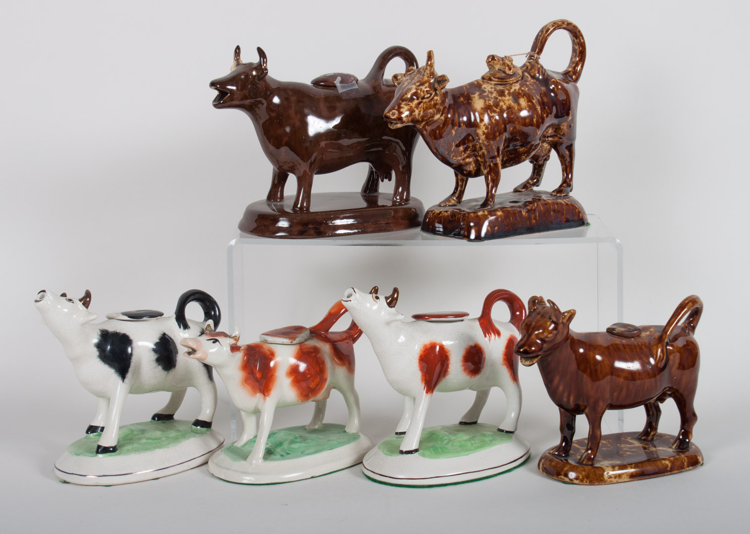 Appraisal: Six Staffordshire cow creamers three modeled as cow standing in