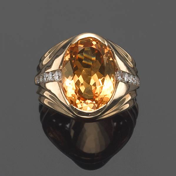 Appraisal: An imperial topaz diamond and k gold ring