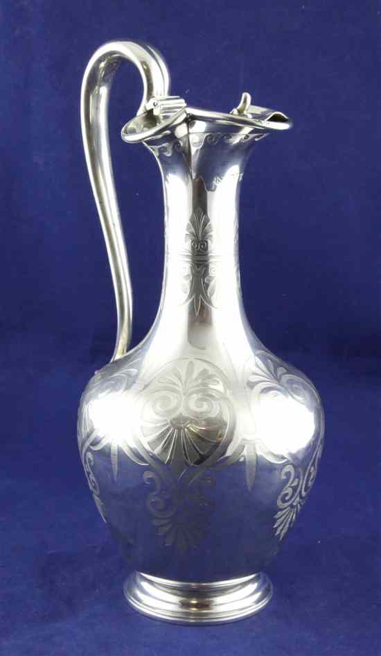 Appraisal: A Victorian engraved silver claret jug by Edward John Barnard