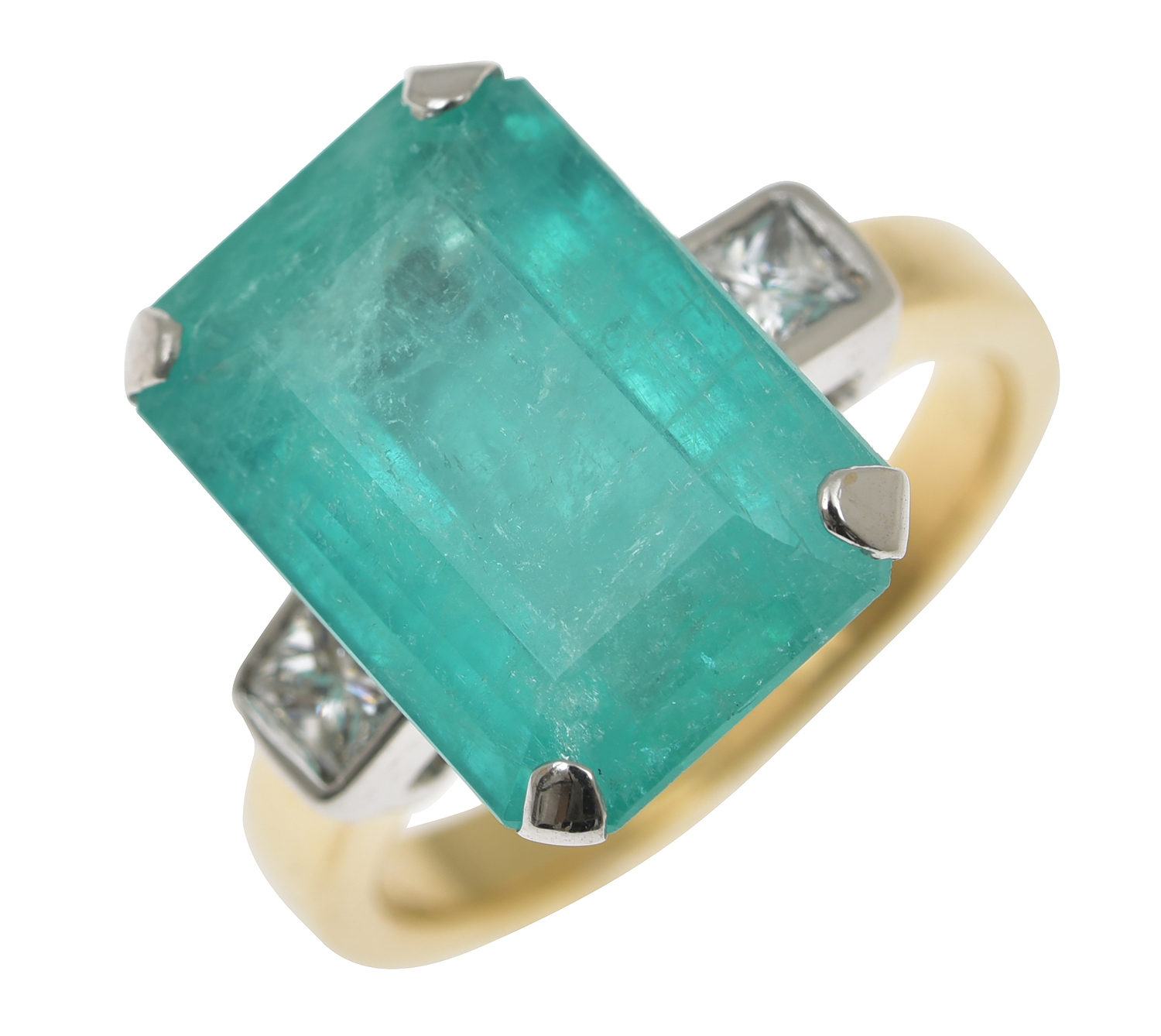 Appraisal: A COLOMBIAN EMERALD AND DIAMOND RING The emerald cut emerald