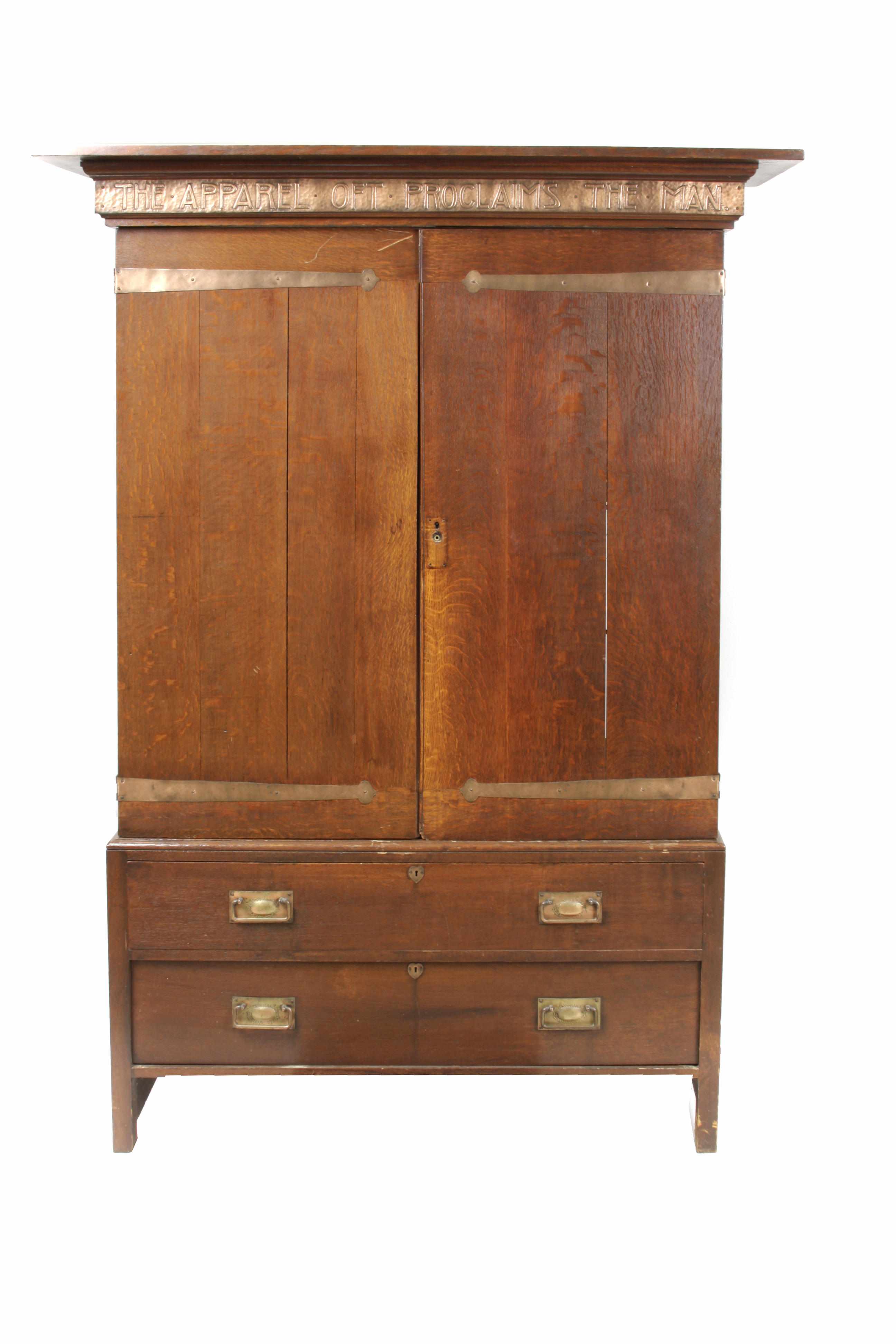 Appraisal: An Arts and Crafts copper mounted oak armoire Bearing the