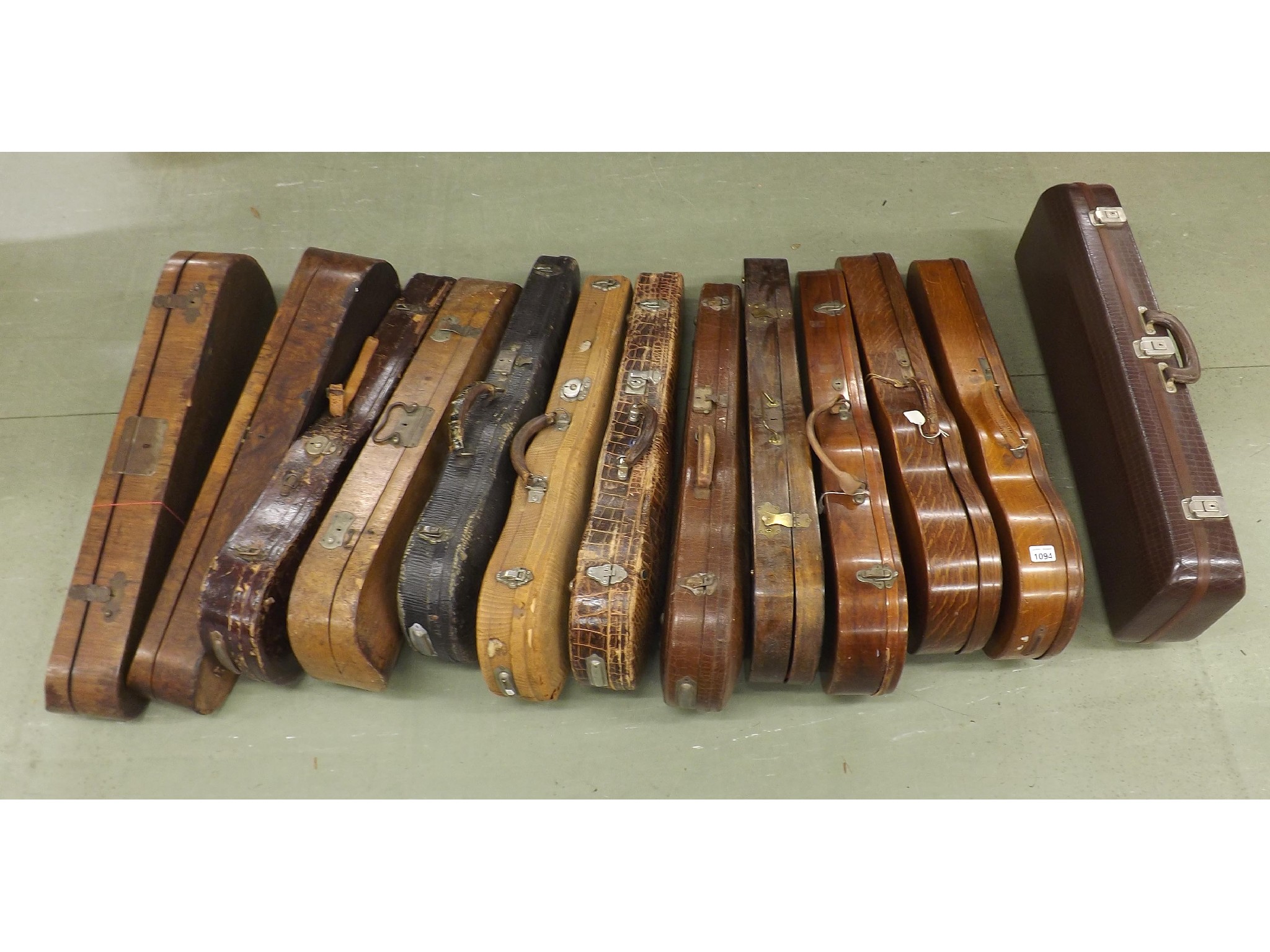 Appraisal: Thirteen various wooden and leather violin cases