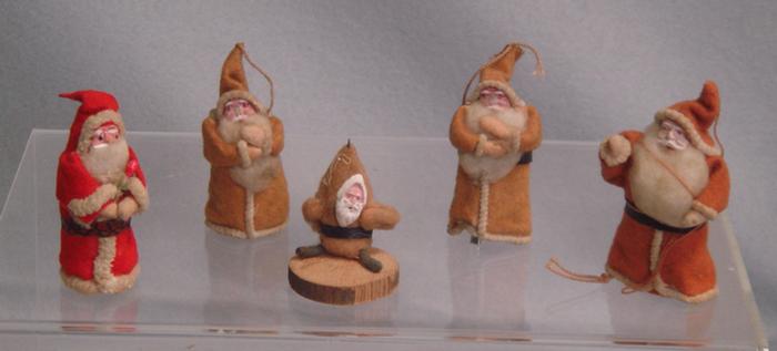 Appraisal: felt paper filled Santa figures to tree ornaments Estimate -