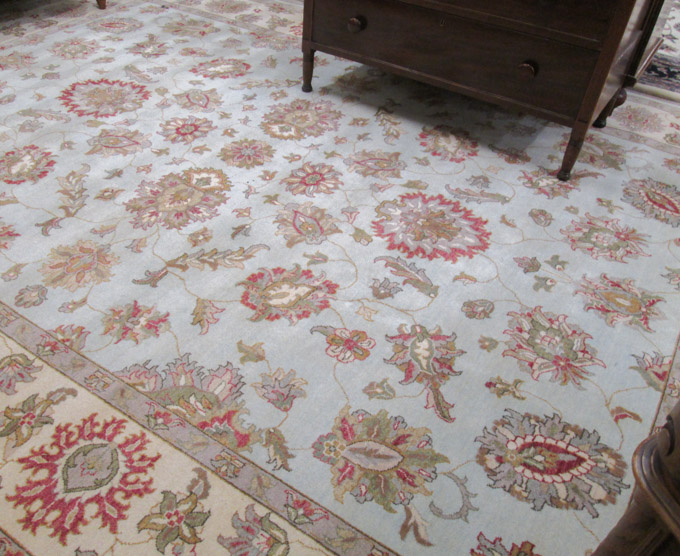 Appraisal: HAND KNOTTED ORIENTAL CARPET Indo-Persian featuring a floral decorated light