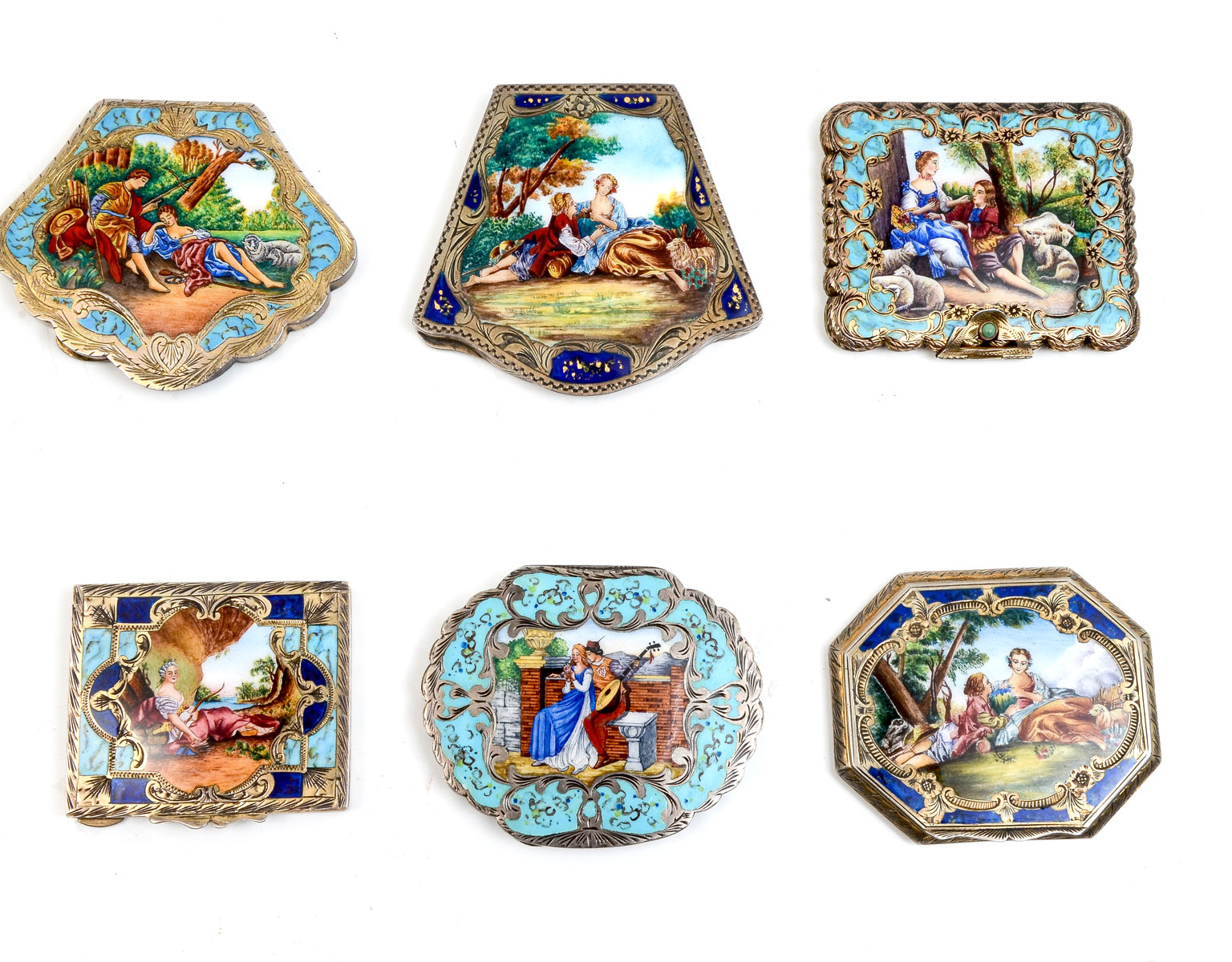 Appraisal: CONTINENTAL ENAMELED GILT SILVER COMPACTS Beautifully done gilt compacts with