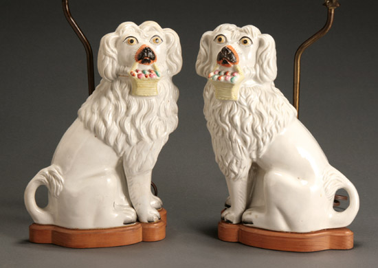 Appraisal: Pair of Staffordshire Figures of Spaniels with Baskets Late th