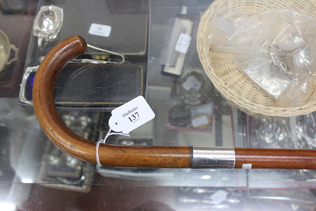 Appraisal: AN OLD WALKING STICK with silver mount and marks for