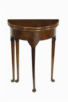 Appraisal: A walnut demi-lune occasional table the double hinged top on