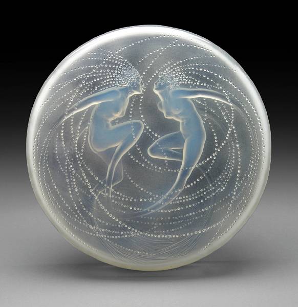 Appraisal: A Ren Lalique molded opalescent glass covered box Deux Sir