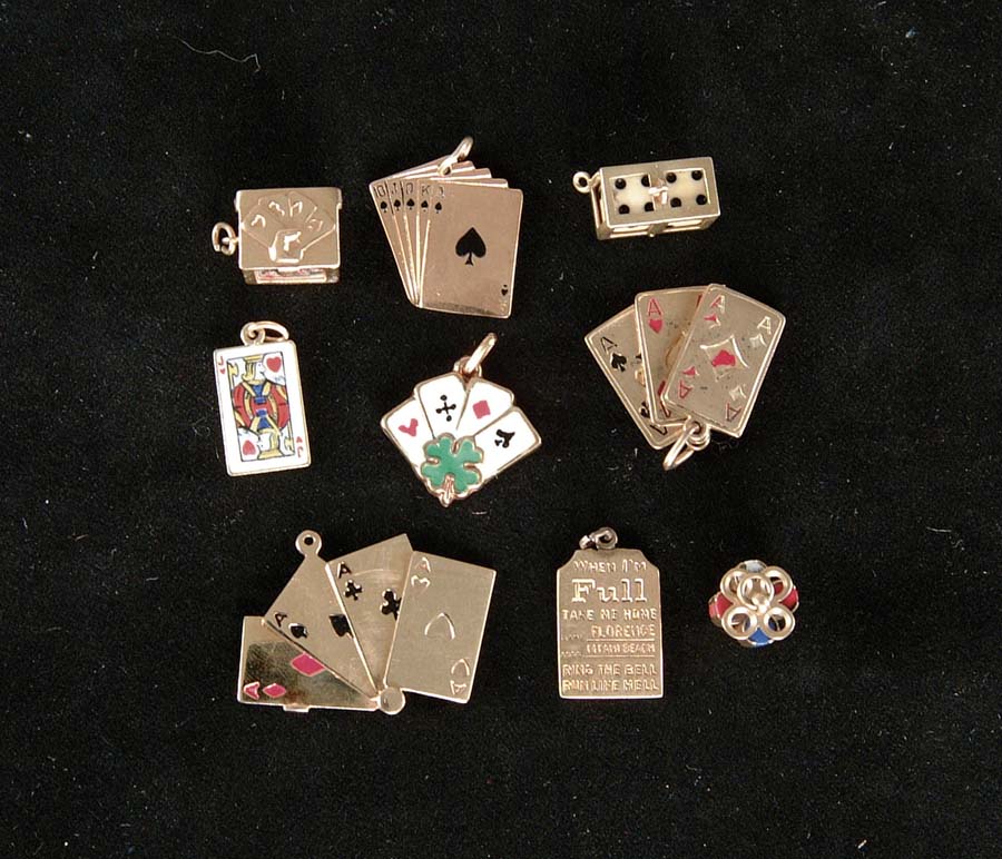 Appraisal: LOT OF GOLD GAMBLING CHARMS Lot consists of sixteen k