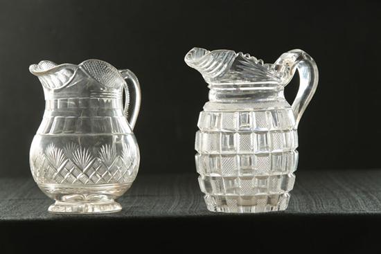 Appraisal: TWO CLEAR CUT PITCHERS American th century flint glass Strawberry