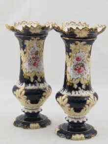 Appraisal: A pair of Coalport vases in cobalt blue with floral