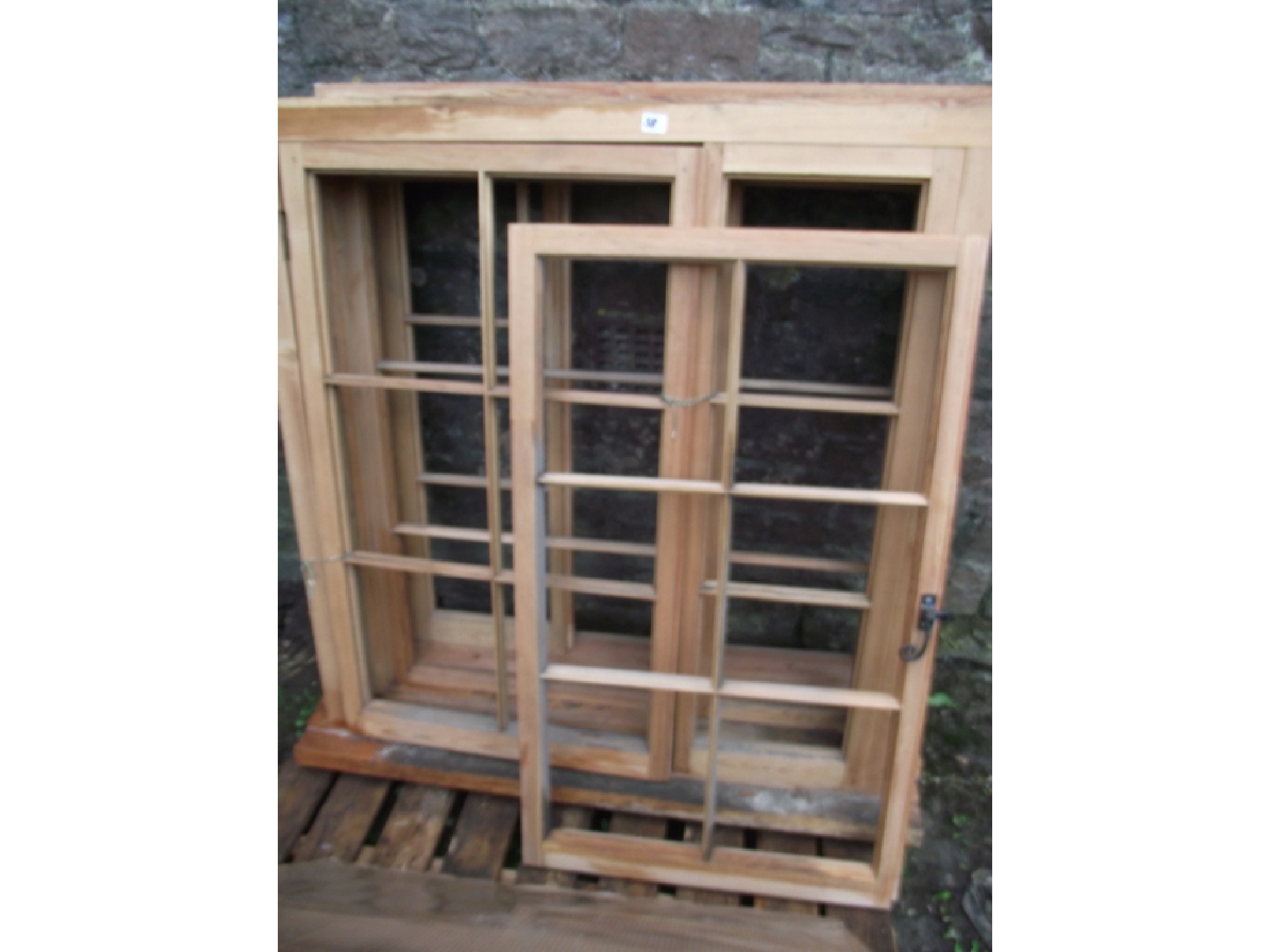 Appraisal: Three stripped pine window frames each enclosed by two segmented