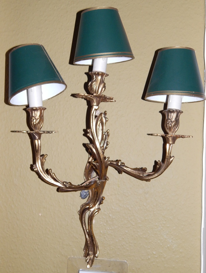 Appraisal: A set of three brass wall lights one with three