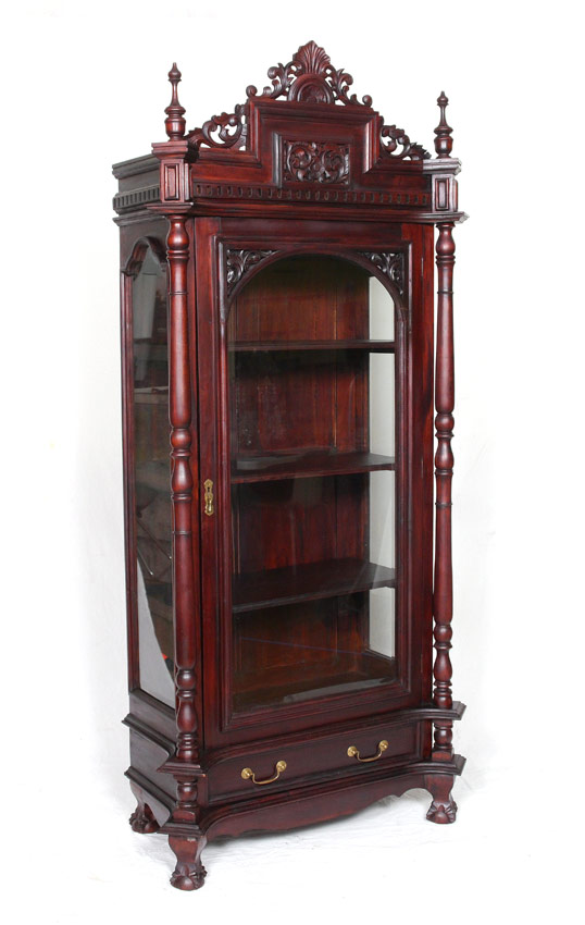 Appraisal: A GRAND CARVED MAHOGANY DISPLAY CABINET th century in the