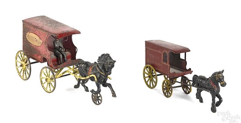 Appraisal: Two Wilkens painted tin horse drawn groceries wago Two Wilkens