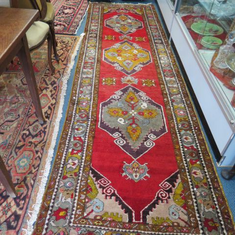 Appraisal: Oushak Turkish Handmade Runner a trio of medallions on red