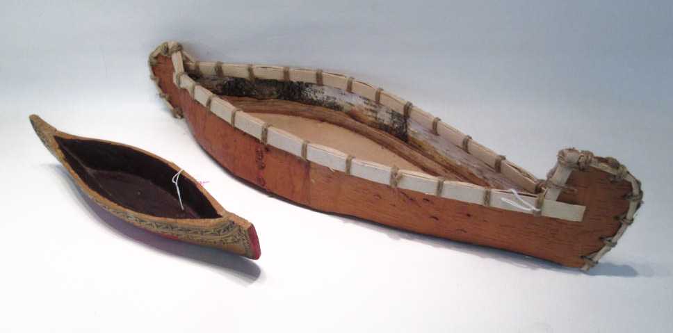 Appraisal: TWO NORTHWEST NATIVE AMERICAN CANOE MODELS the first of carved