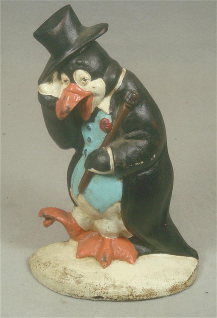 Appraisal: Cast iron doorstop colorful penguin in tuxedo with cane and