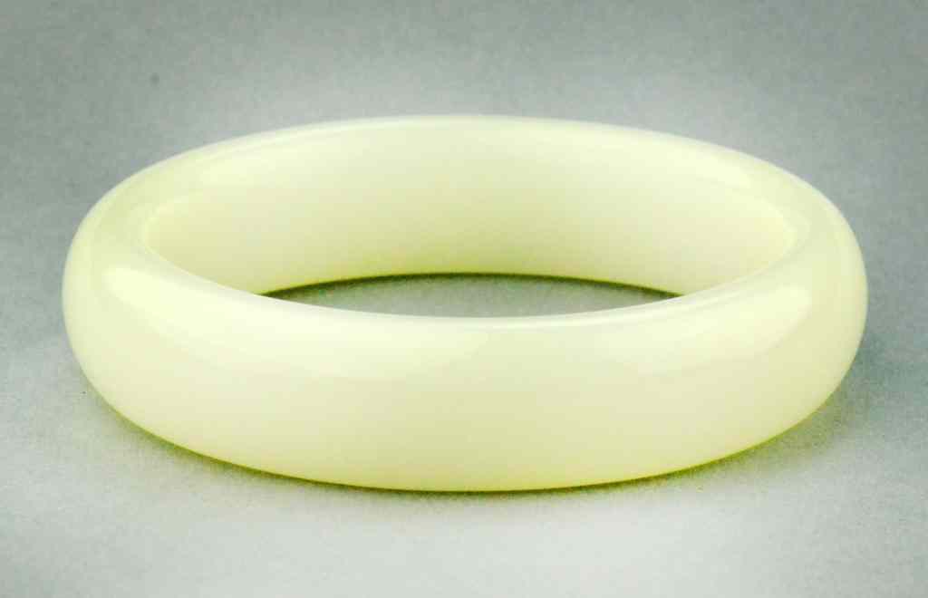 Appraisal: Chinese White Jade Bangle BraceletThe stone an even white color