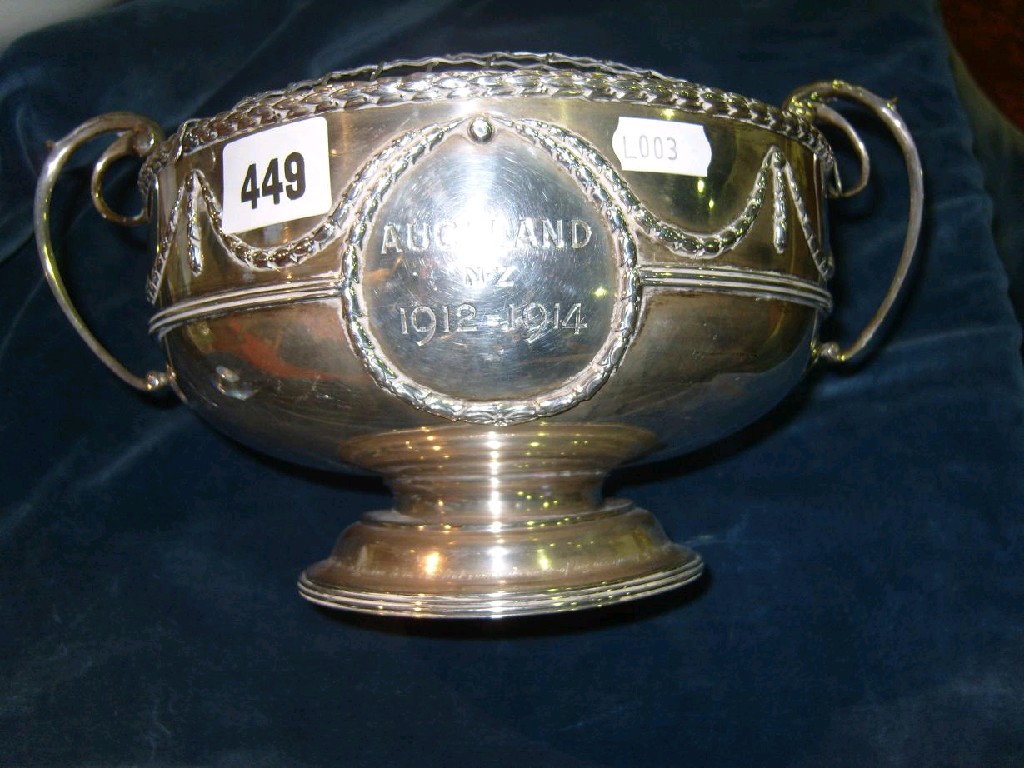 Appraisal: A silver rose bowl of circular form with loop handles