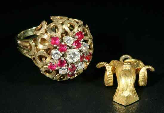 Appraisal: K YELLOW GOLD DIAMOND AND RUBY RING Openwork floral design