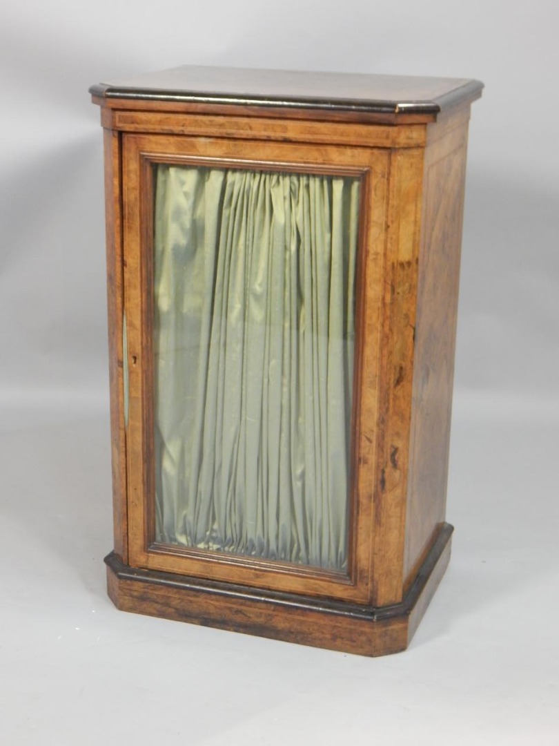 Appraisal: A Victorian figured walnut and ebonised side cabinet the rectangular