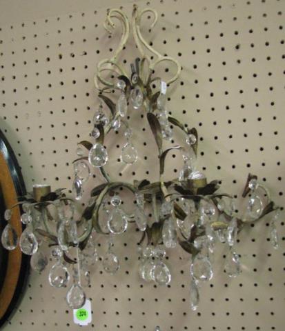 Appraisal: A French metal and crystal wall sconce with two candle