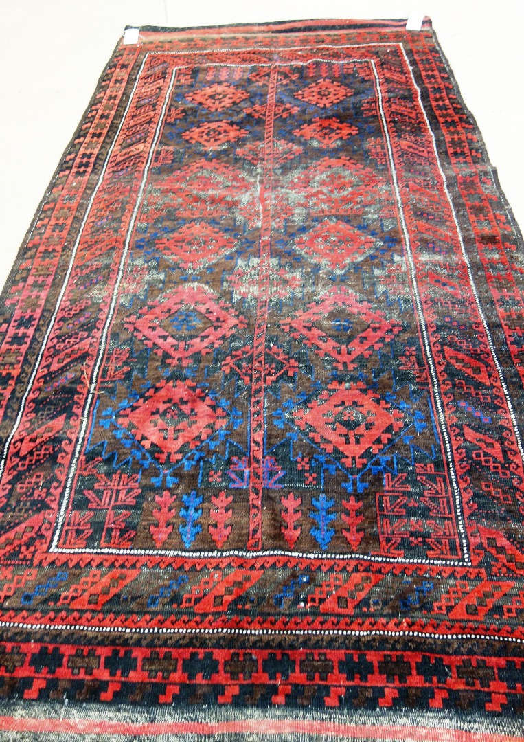 Appraisal: A Beluchistan carpet the brown field with a stylised tree