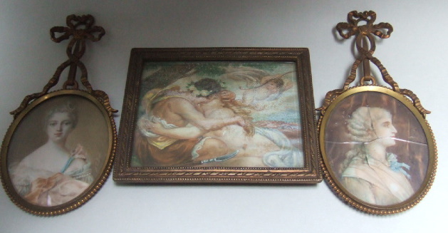 Appraisal: A rectangular miniature depicting an amorous couple with a cherub