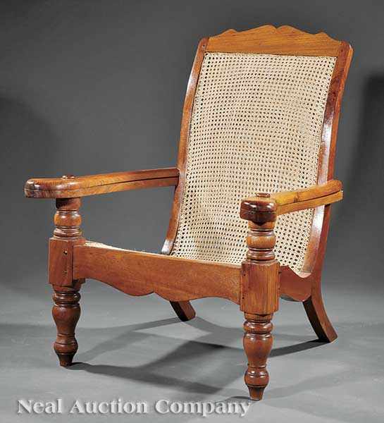 Appraisal: A Carved Hardwood Planter's Chair continuous caned seat with shaped