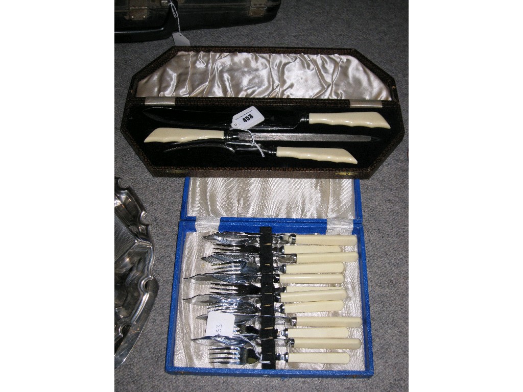 Appraisal: Lot comprising carving set and a fish cutlery set