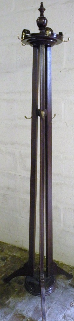 Appraisal: A thC stained beech coatstand with brass pegs surmounted by