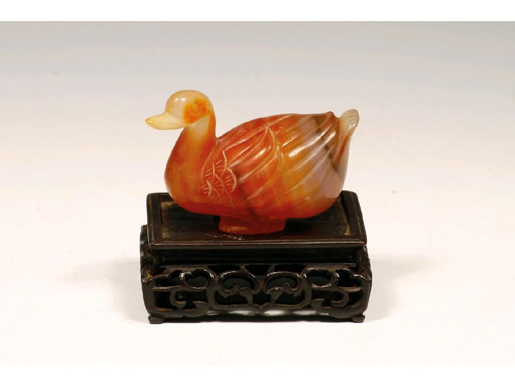 Appraisal: A CHINESE CARVED AGATE FIGURE OF A GOOSE on a