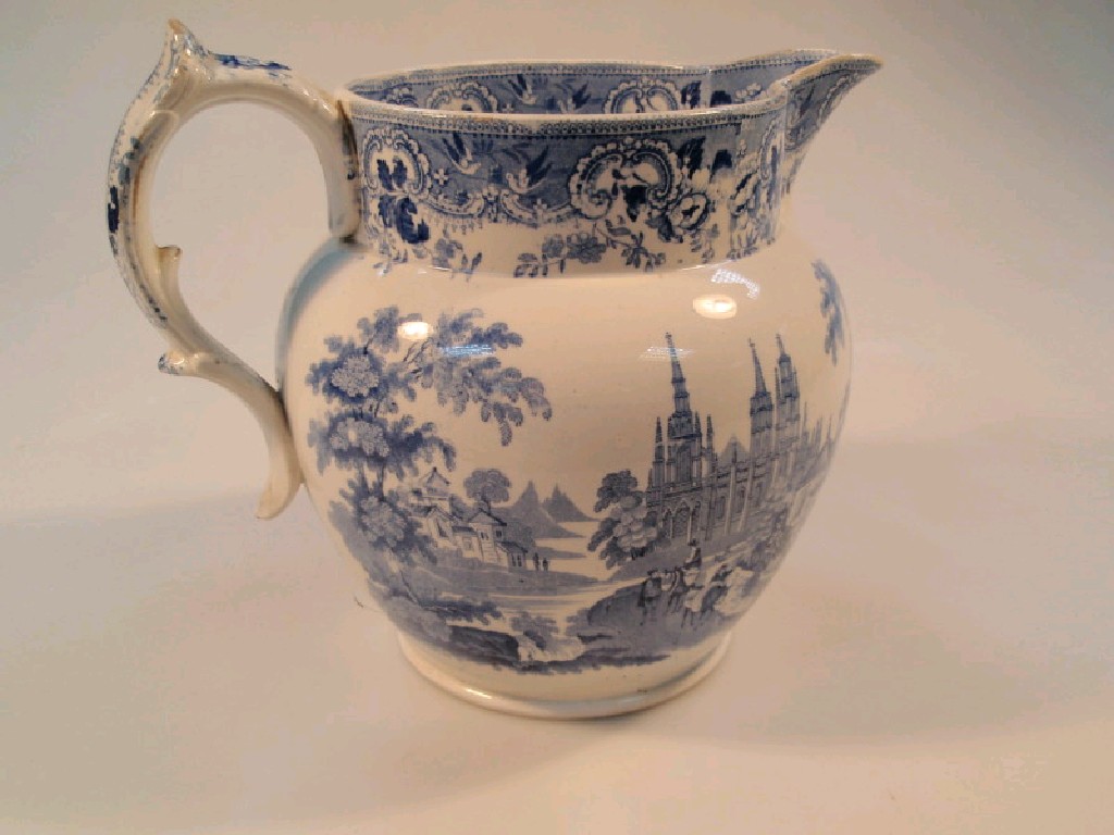 Appraisal: A thC blue transfer pottery jug printed with travellers in