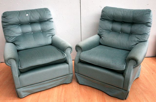 Appraisal: A pair of light blue upholstered armchairs