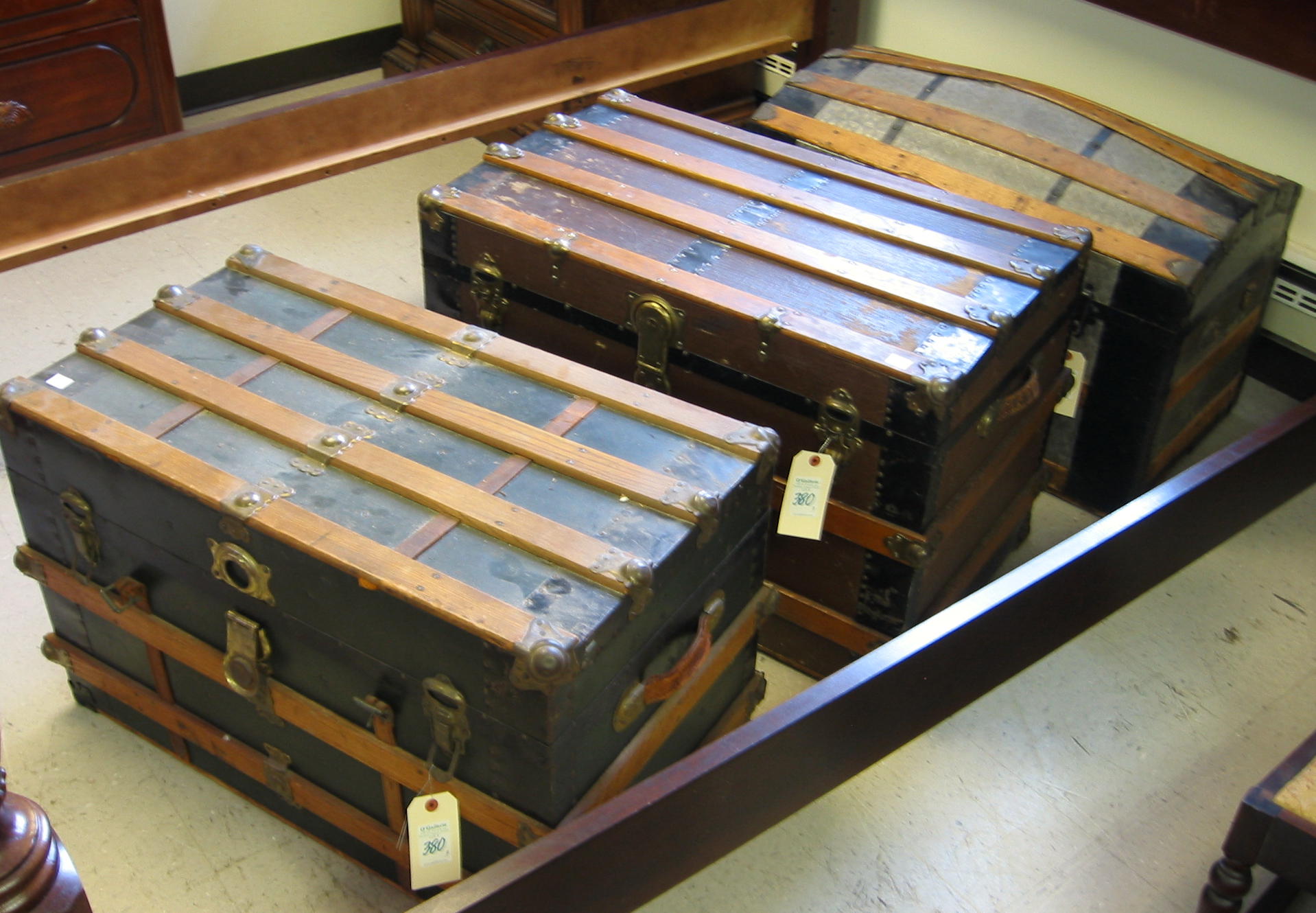 Appraisal: THREE OLD STEAMER TRUNKS American c - including two flat-top