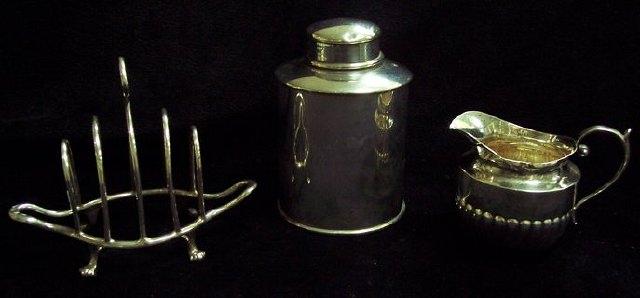 Appraisal: A tea caddy of cylinder shape a cream jug and