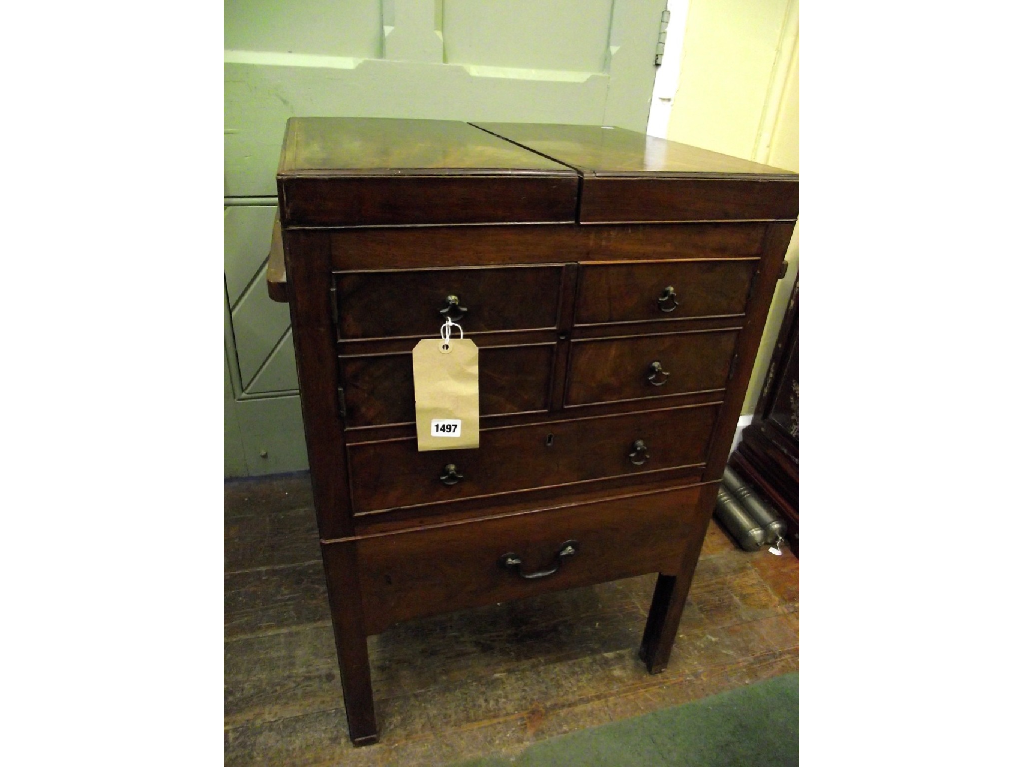 Appraisal: A Georgian mahogany gentleman's fold over top washstand over an