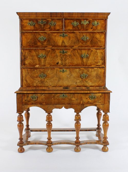 Appraisal: A George II walnut and laburnum chest on stand the