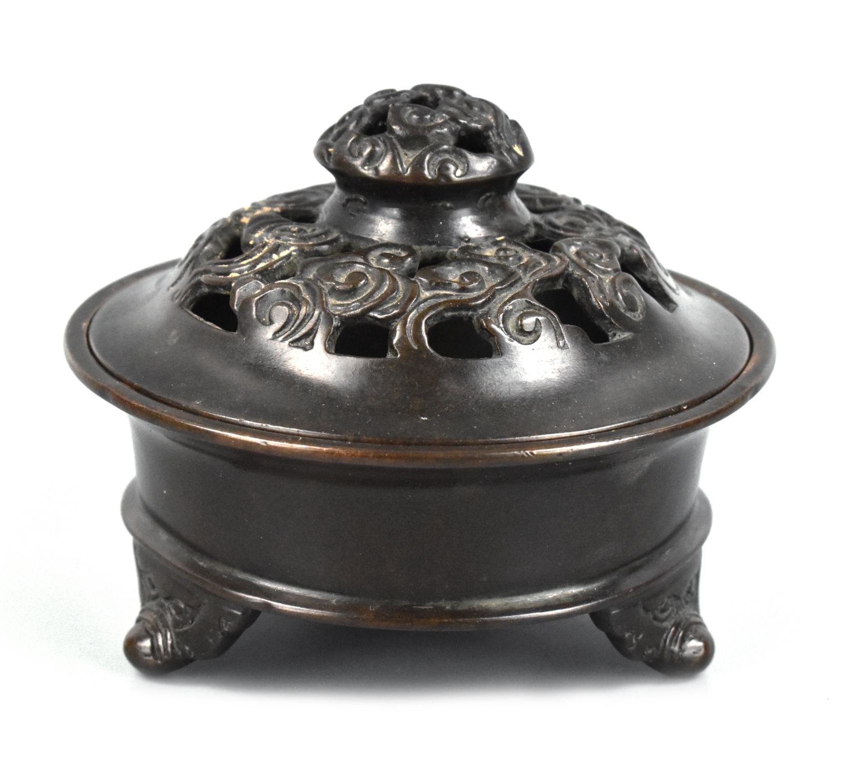 Appraisal: A circular Chinese bronze tripod incense burner dating from the