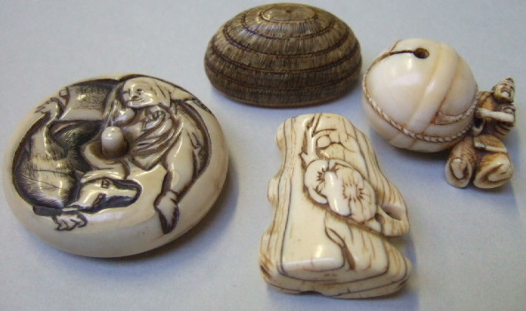 Appraisal: Four ivory netsuke th century comprising a study of a