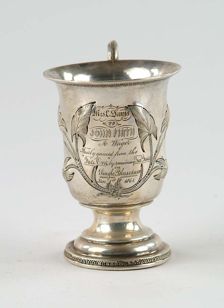 Appraisal: PRESENTATION HANDLED COIN SILVER FOOTED CUP Signed on base with